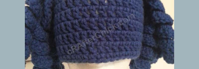 http://crafterchick.com/arthritis-awareness-blue-curly-pigtail-beanie-hat-crochet-pattern/