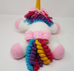 Rainbow Cuddles Stuffed Crochet Unicorn with Bow on Tail Project (back view) a chick crafting through Rheumatoid Arthritis cRAfterChick.com